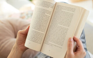 person holding book in hands - line spacing in vellum
